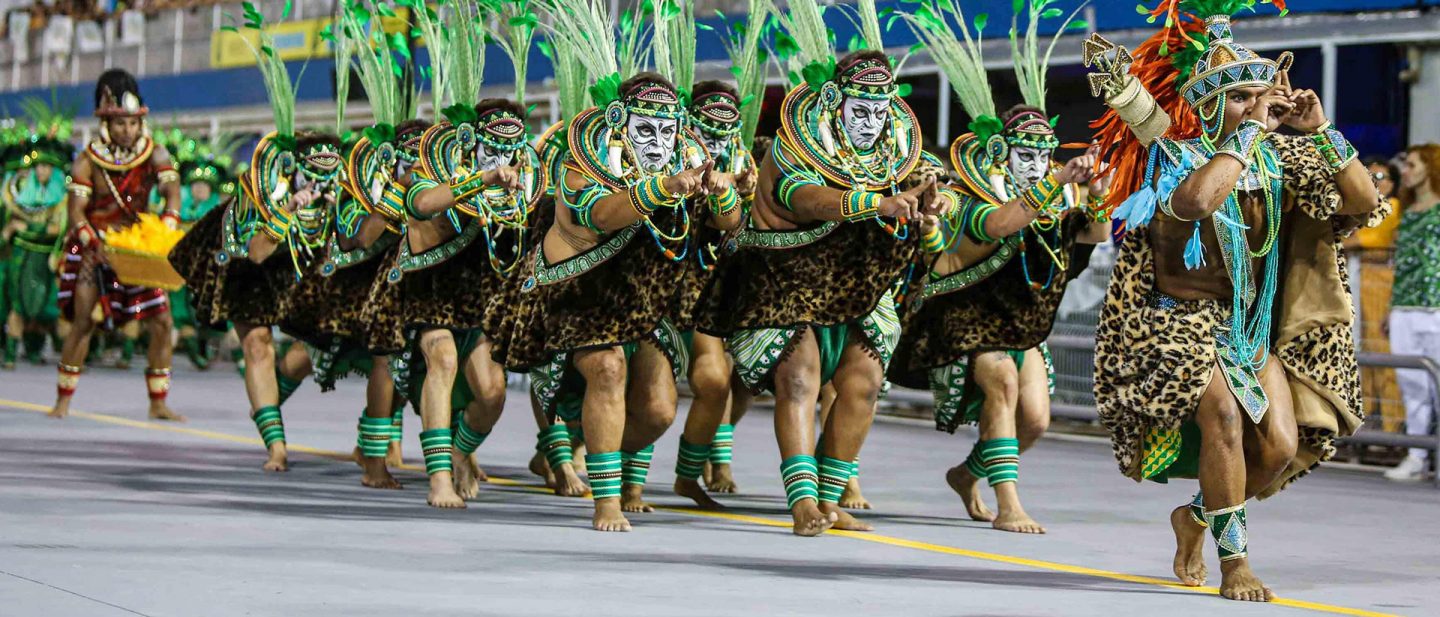 A group of samba dancers in eye-catching costumes.