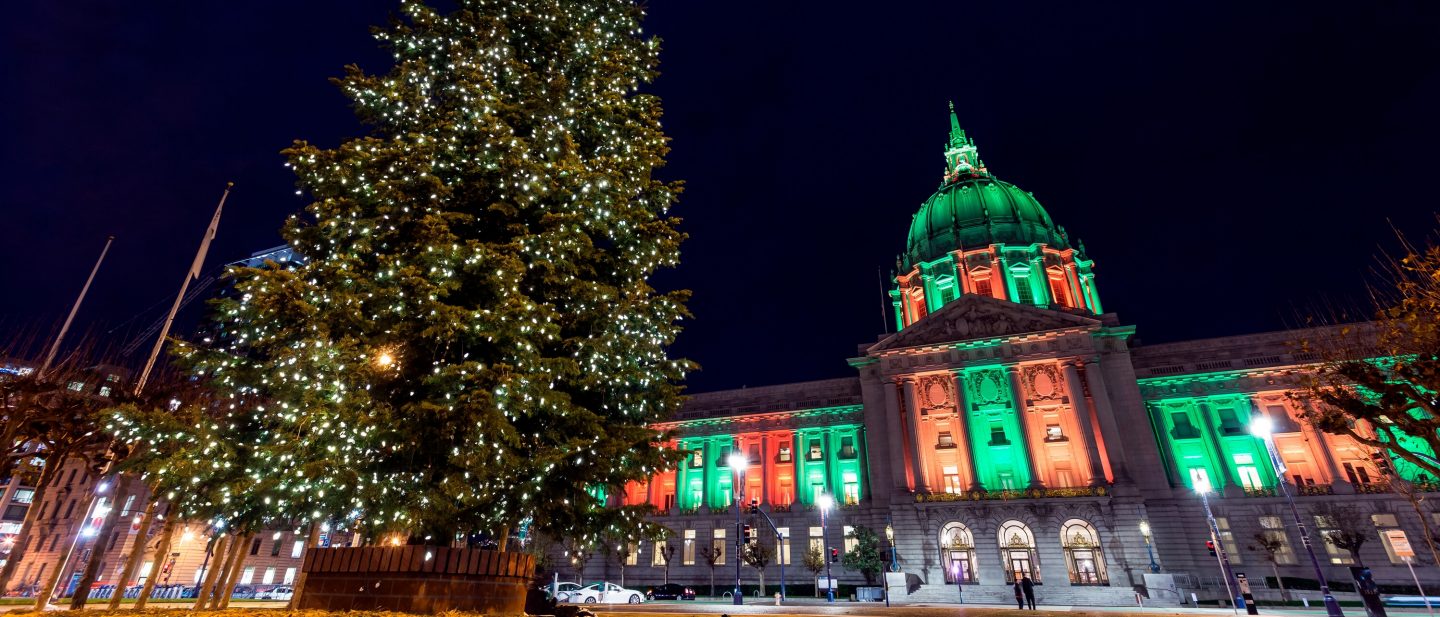 San Francisco City Hall decorated with Christmas lights and colors with tree.; 